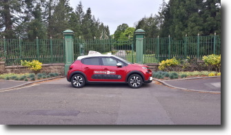 mike's driving lessons instructor car in front of the gates at royton park